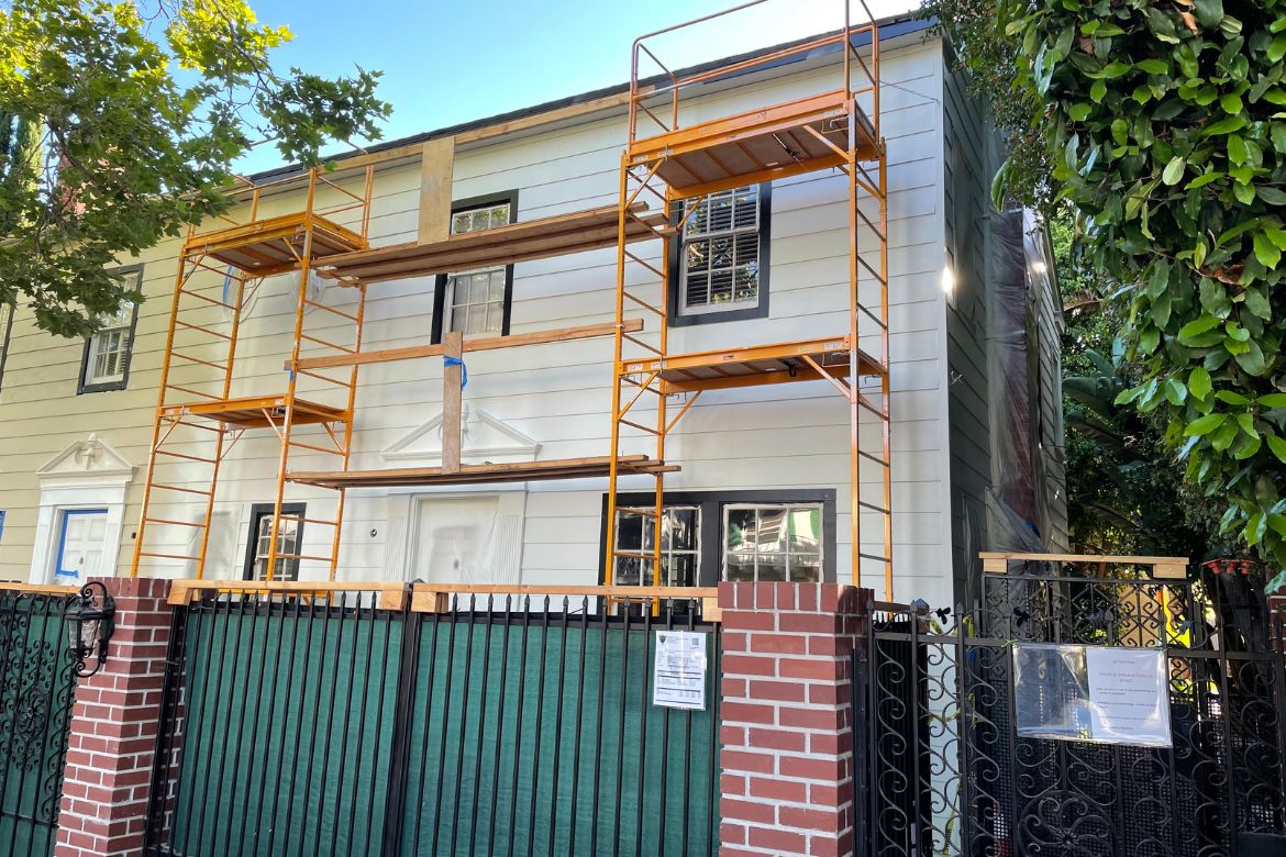 Residential exterior renovation with scaffolding during siding and facade upgrades