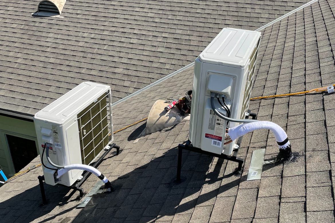 Roof-mounted HVAC system installation on residential home