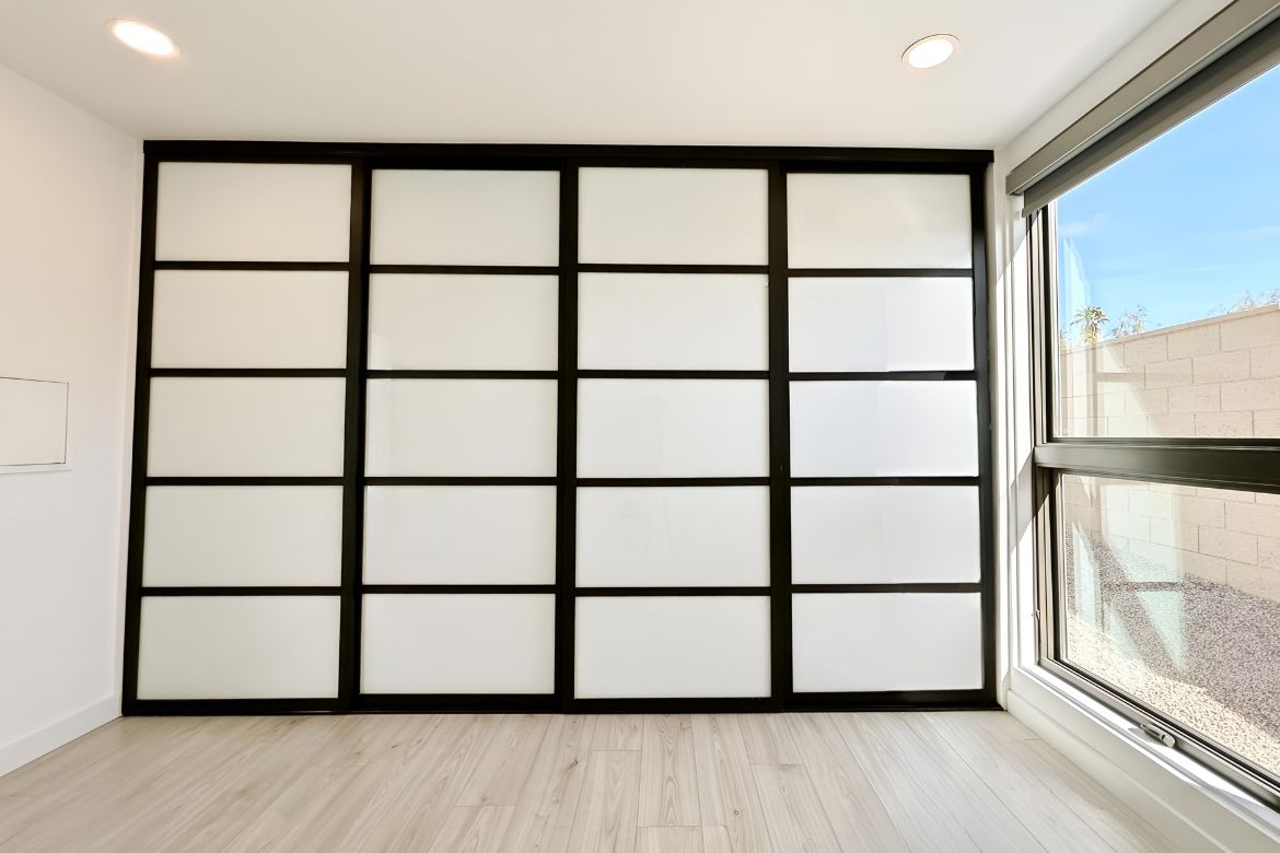 Modern interior room divider with sliding panel system and clean minimalist finishes